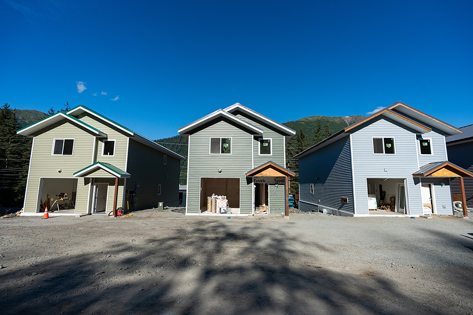 Three new homes being built side by side