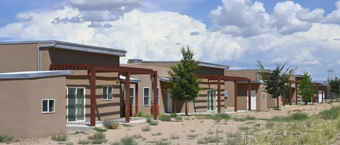 Wa-Di Housing development in Santo Domingo, New Mexico against a blue clouded sky
