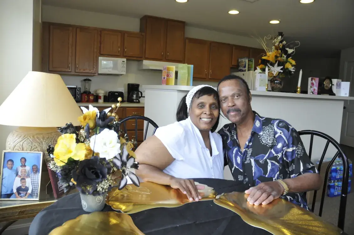 Photo of couple at kitchen table