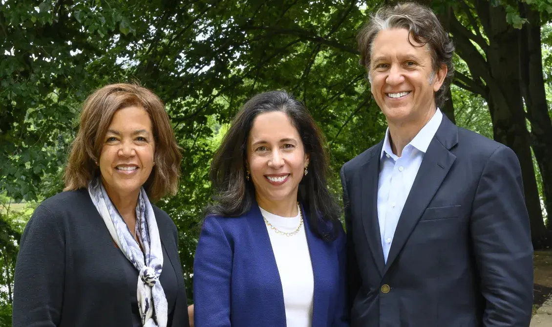 Phyllis Caldwell, Priscilla Almodovar, and Rick Lazio pose and smile outdoors