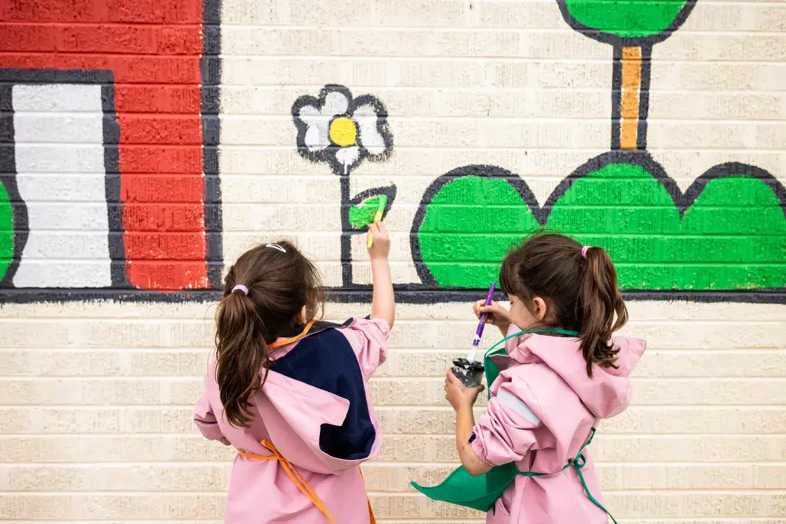 Children painting a mural