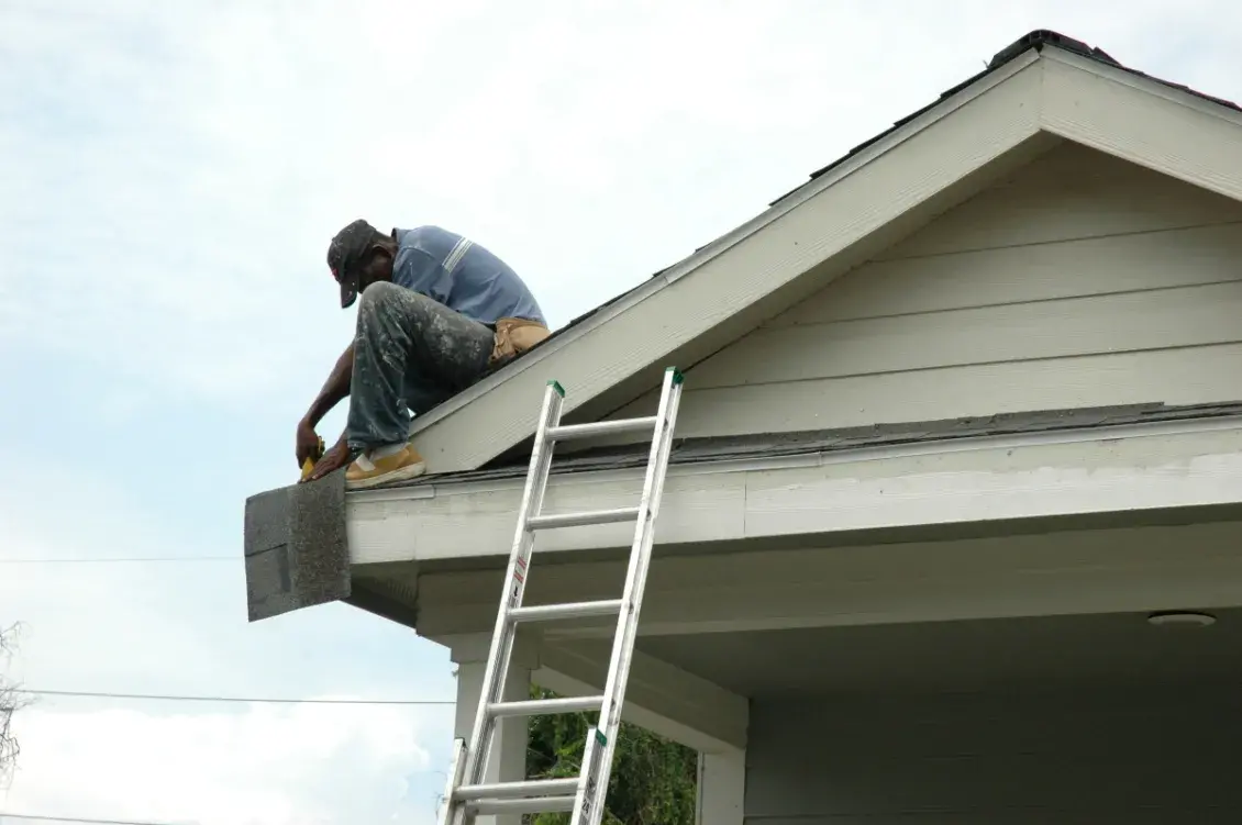 Man repairing roof