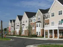 Apartments line a neighborhood block