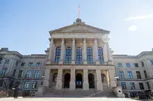 Skyward view of the main entrance of a state capitol building
