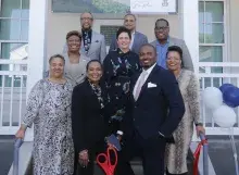 People standing on stairs of new home 