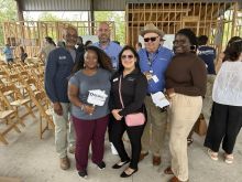 CU Housing, Lending, and Environmental team members with Codney Washington of WE Build at the Grand Opening of DreamBuild. 