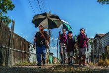 Family taking a walk on a hot day