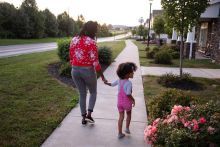 Mother and child walking on path