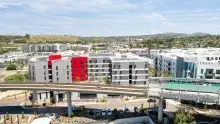 Aerial view of apartment buildings and a highway overpass