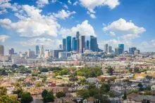 City skyline of buildings of different heights and neighborhoods