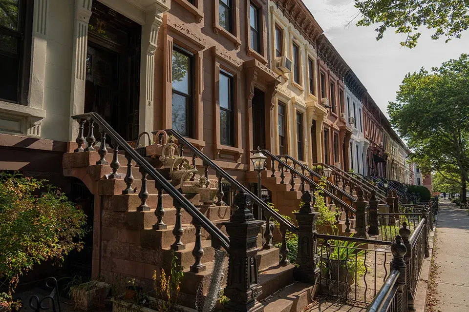 An apartment block of brownstone homes in New York