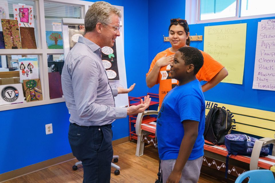 Enterprise CEO Shaun Donovan speaking with boy