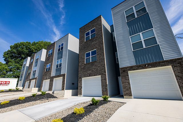 New homes including garages built with brick and siding