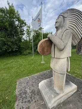 Stone carving of Chief Willard Leroy Ackley