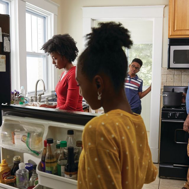 Black family in their kitchen