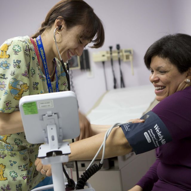 women getting her blood pressure checked