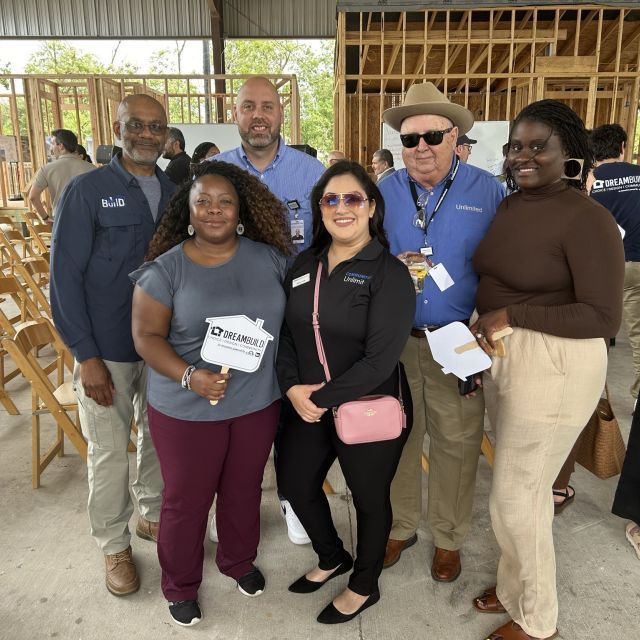 CU Housing, Lending, and Environmental team members with Codney Washington of WE Build at the Grand Opening of DreamBuild. 