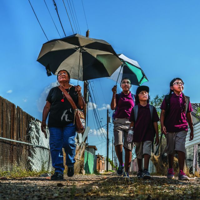 Family taking a walk on a hot day