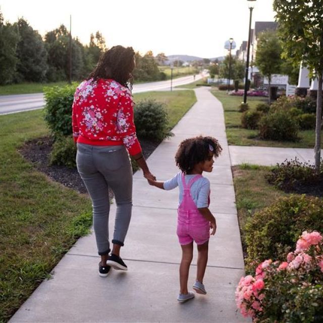 Mother and child walking on path