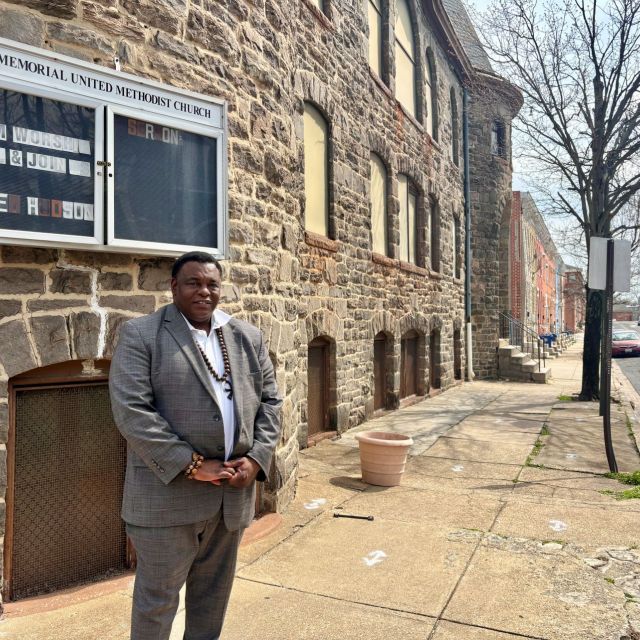 Pastor Rod Hudson, standing outside the Ames Memorial United Methodist Church in West Baltimore