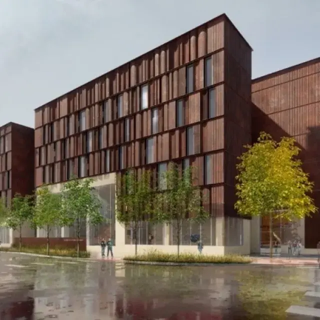 Rendering of an apartment building with trees lining the sidewalks and people walking by