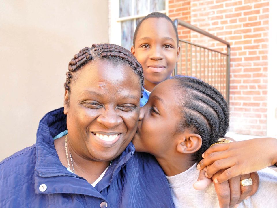 A family living at Jenkins House affordable apartments in Maryland.