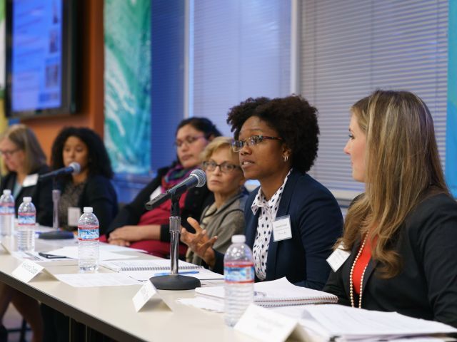 A group of woman speaking on a panel