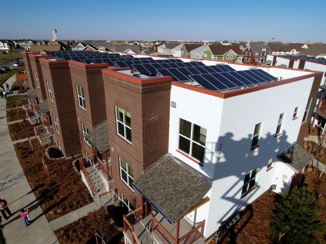 Aerial view of Central Park Stapleton building with solar panels installed on the rooftops
