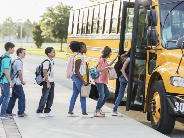 Children in line to board a school bus