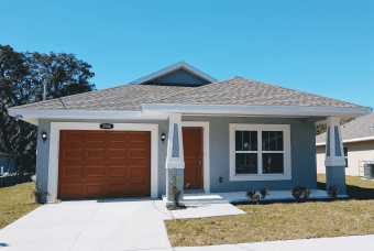 A gray house with brown doors